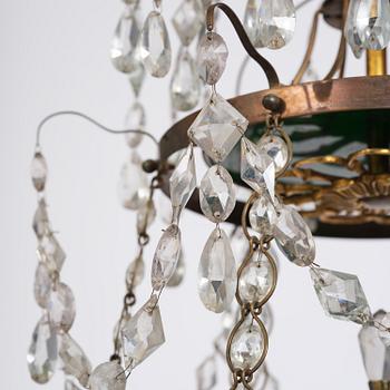 A Late gustavian green top glass six light chandelier.