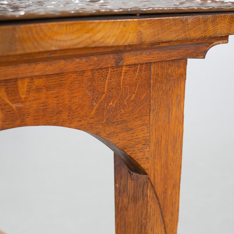 CARL CHRISTIAN CHRISTENSEN, a jugend smoking table, signed and dated 1910.