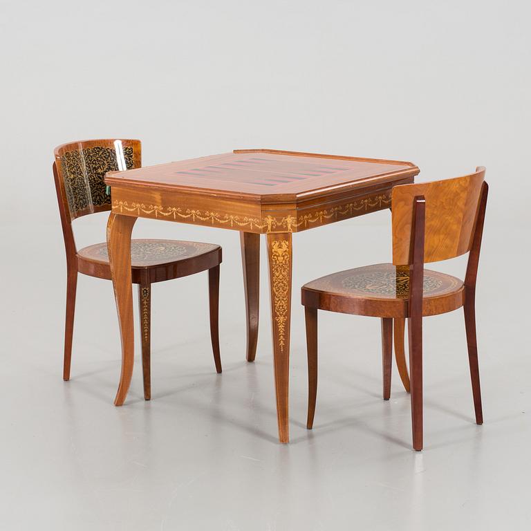 A gaming table and two chairs from Italy, 1950s.