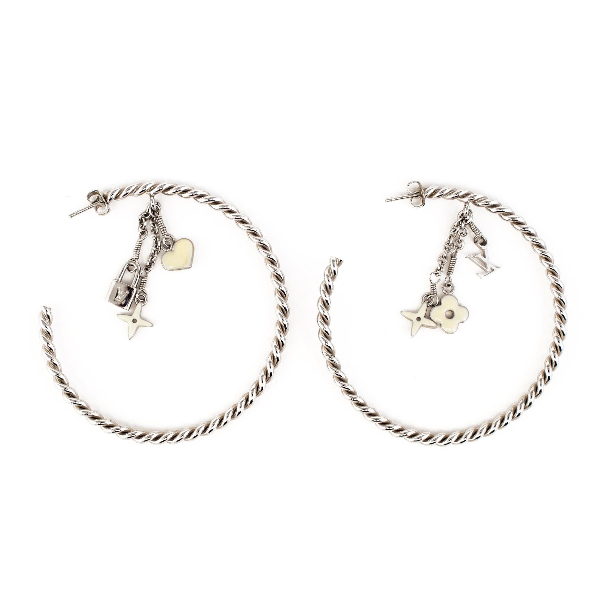 LOUIS VUITTON, a pair of charm earrings.