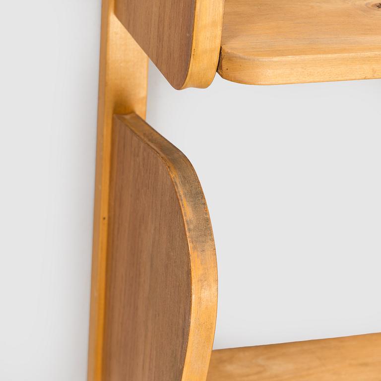 A mid-20th century 'Poika' wall shelf by HMN Huonekaluliike Mikko Nupponen.