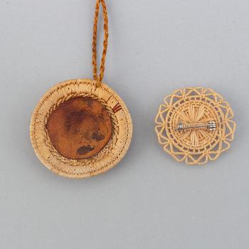 A Sami root brooch and pendant.