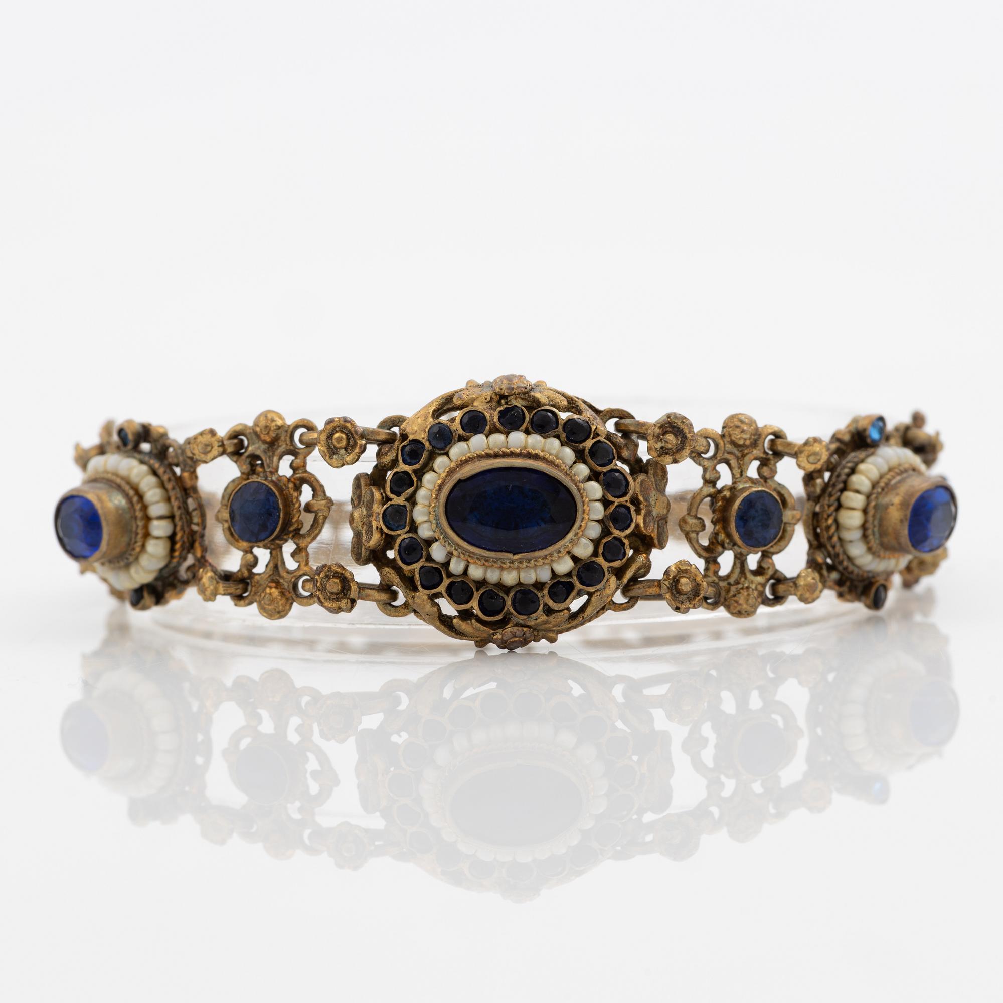 Bracelet, gilded silver with synthetic blue stones.