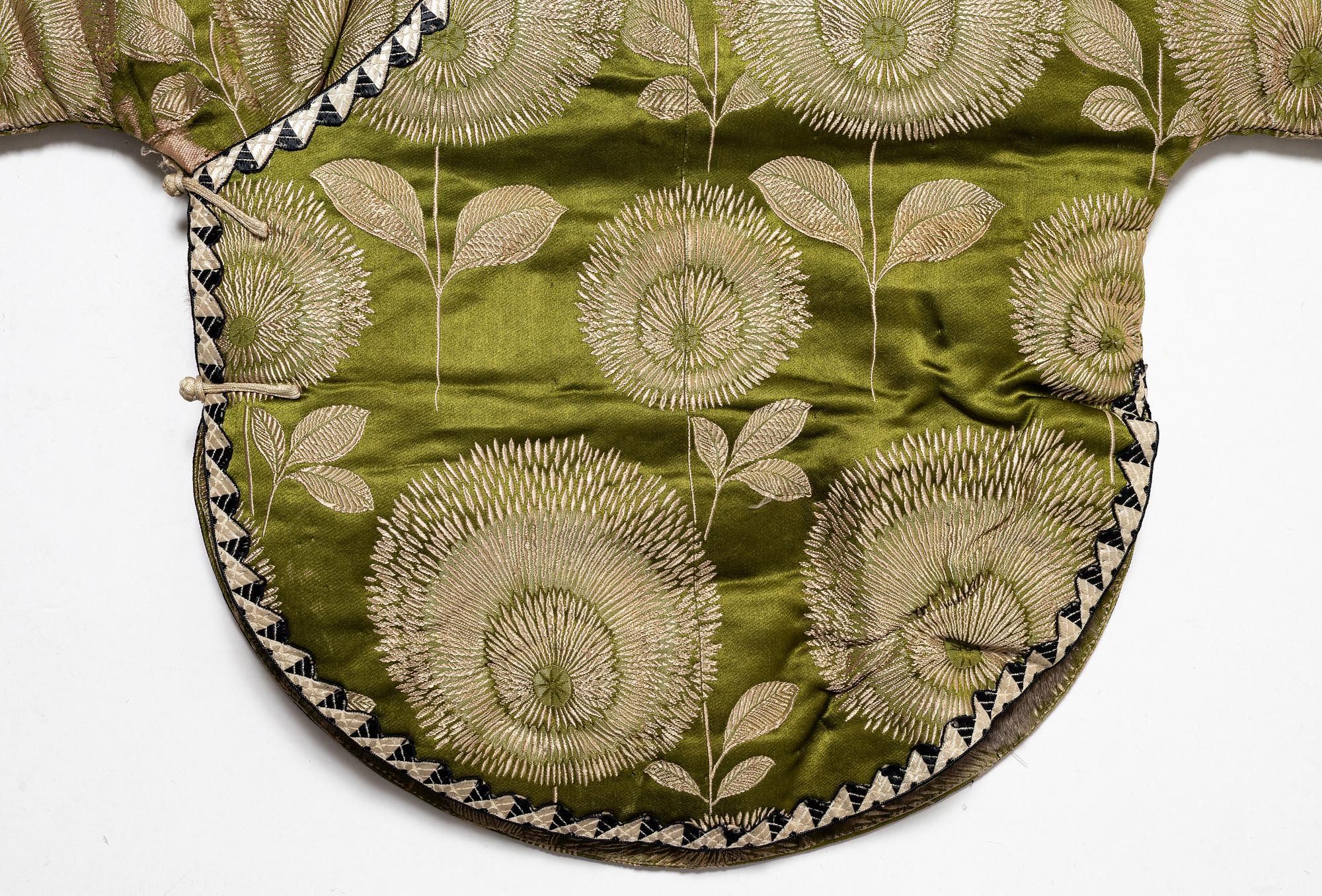 A Japanese silk brocade and fur childrens jacket, Meiji (1868-1912).