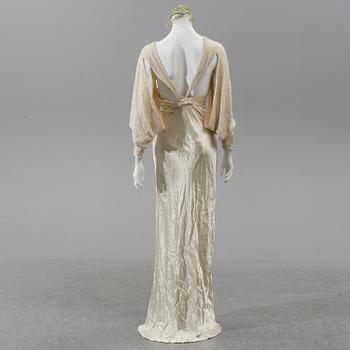 A satin wedding dress, circa 1935.