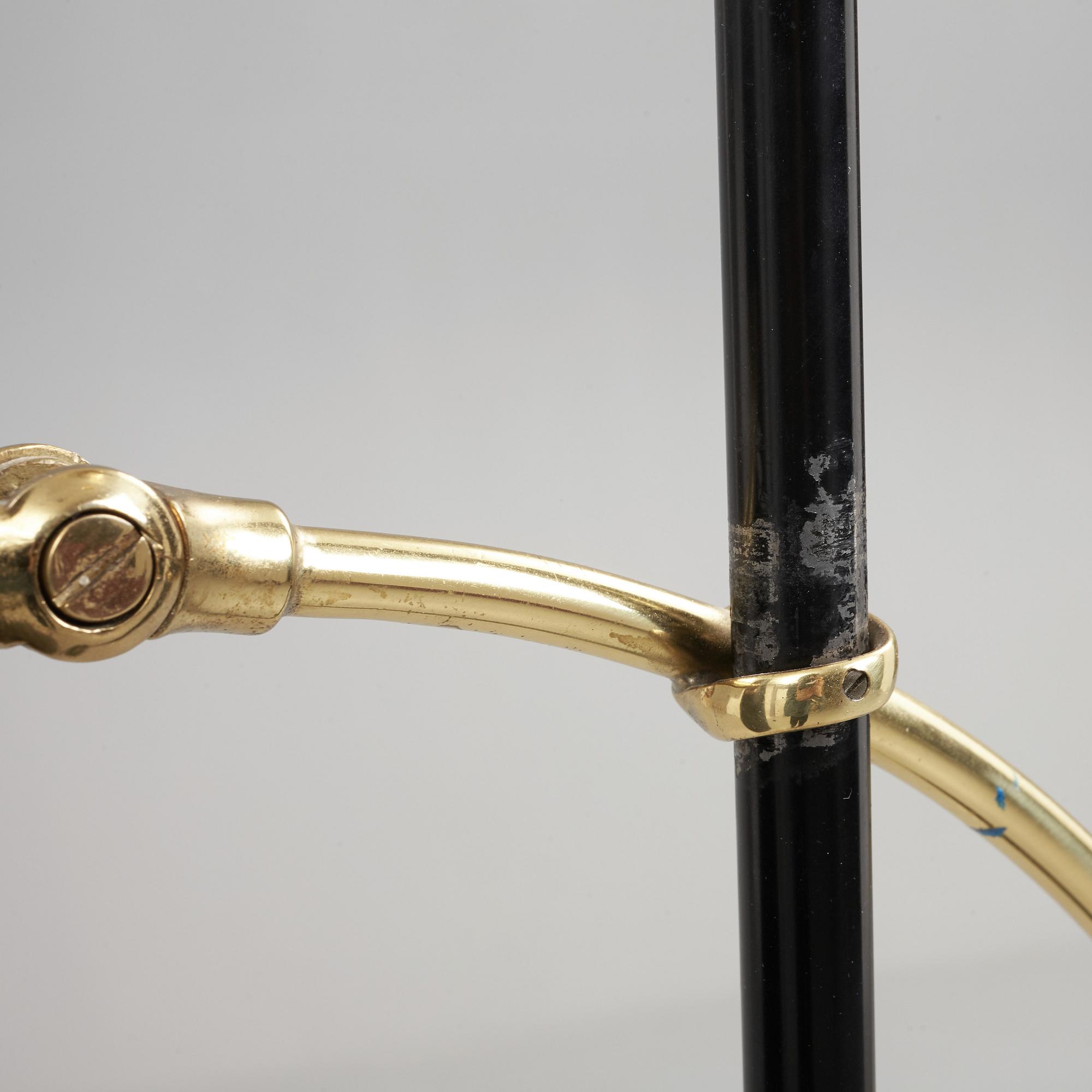 A Swedish Modern brass and black lacquered floor lamp, 1950's.