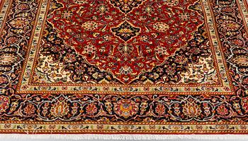 A carpet, Kashan, signed, ca 300 x 204 cm.