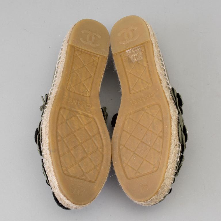 A pair of espadrilles from Chanel.