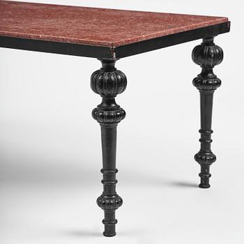 A table with granite stone top from Älvdalen, first part 19th century on a later metal stand.