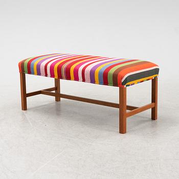 A model 2028 bench by Josef Frank for Firma Svenskt Tenn.