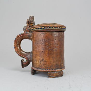 A 19th century painted wooden tankard.