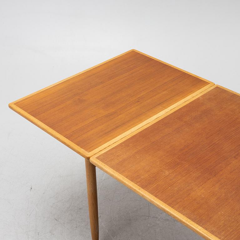 A teak and oak dining table, Scandinavia, 1960's.