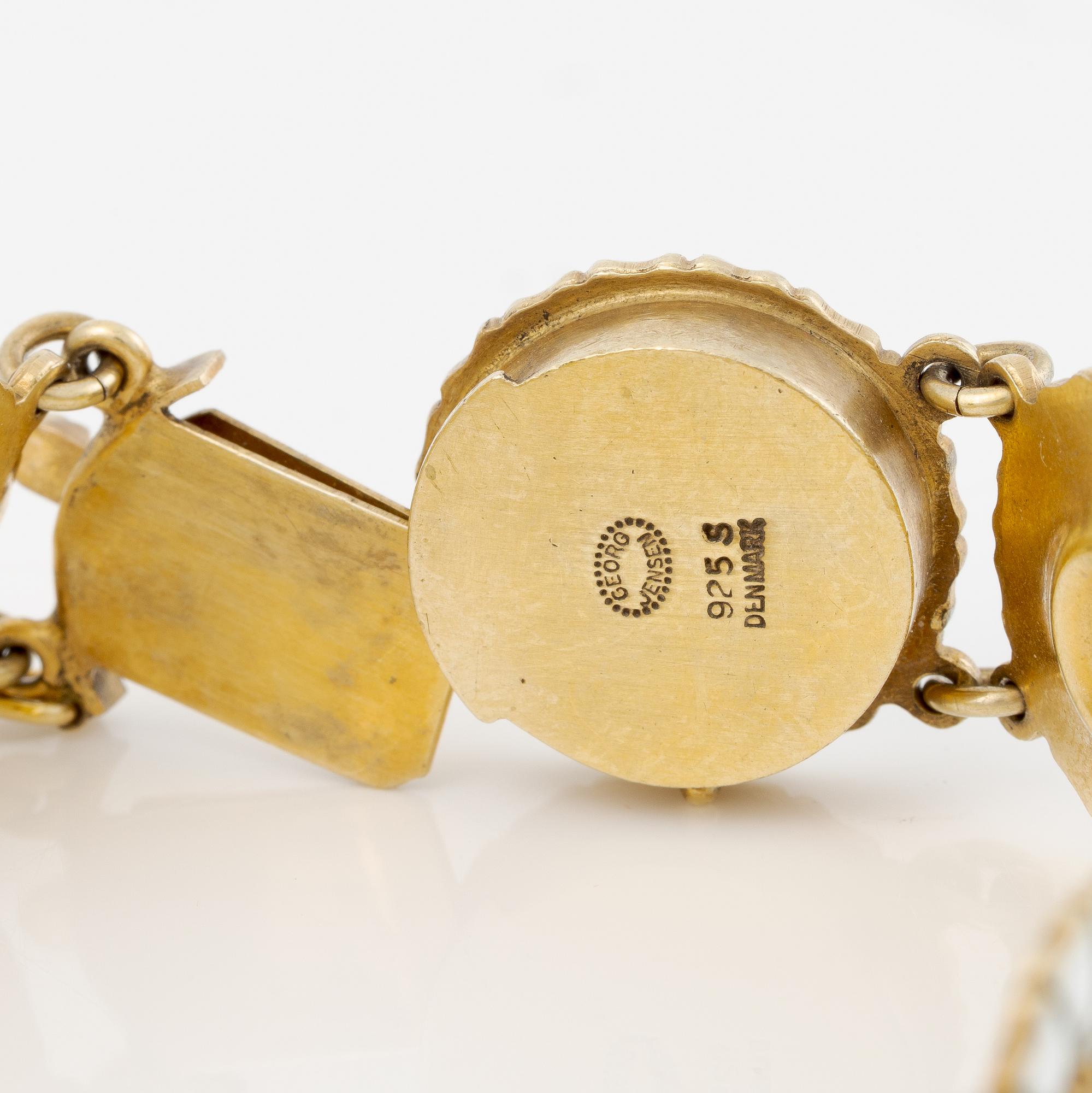 Georg Jensen and A Michelsen "Daisy" a bracelet, a pendant, and a brooch silver gilt and enamel.