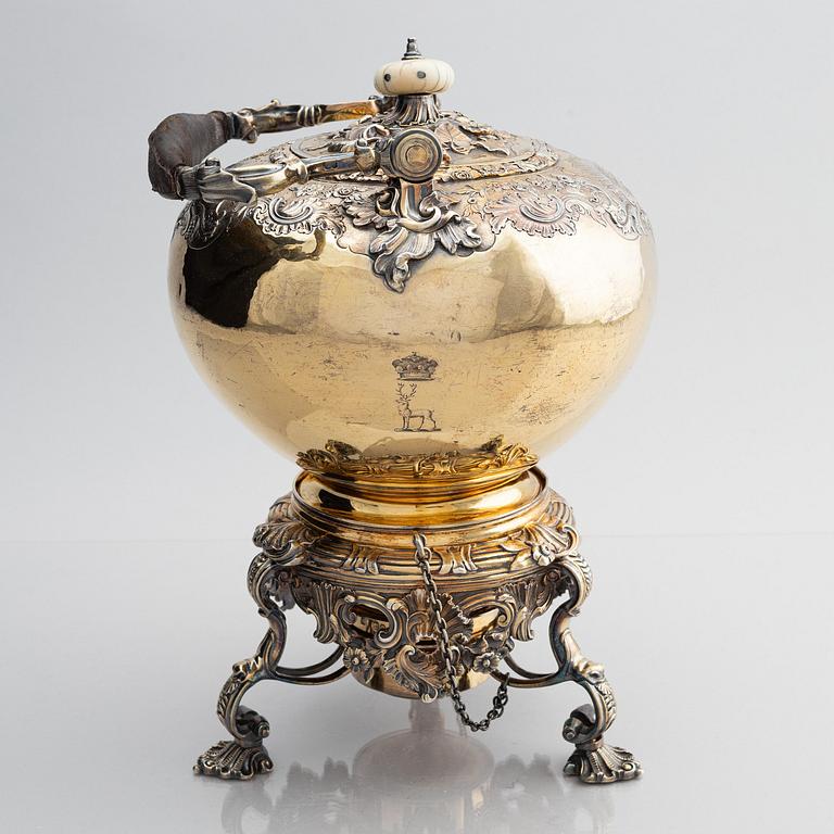 An English silver-gilt teapot with stand and burner, mark of Richard Sibley I, London 1825.