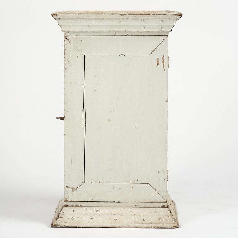 A Gustavian column-shaped cabinet, circa 1800.
