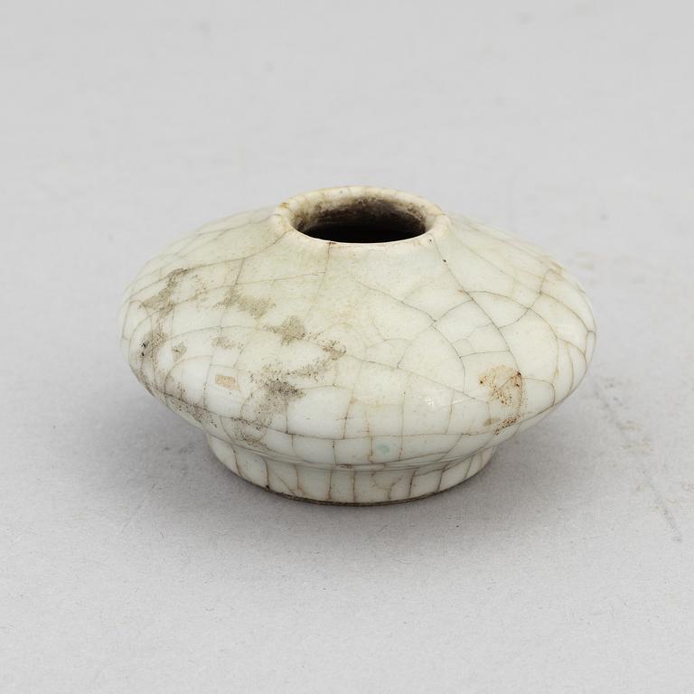 A Chinese celadon glazed lotus leaf shaped bowl, late Qing dynasty, and a ge-glazed brush washer, possibly 20 century.