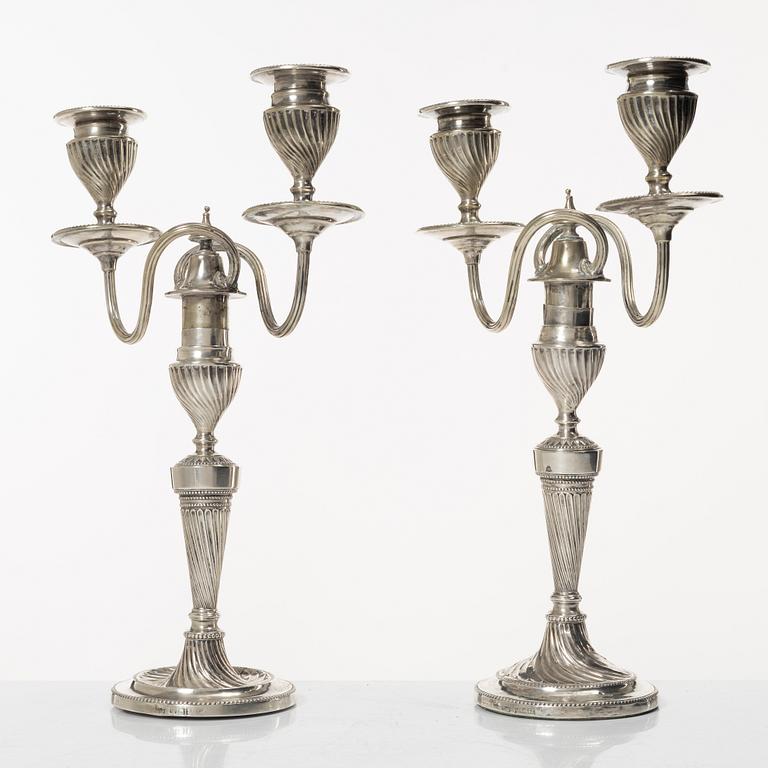 A pair of English silver candelabra, mark of Hawksworth, Eyre & Co Ltd, Sheffield 1892.