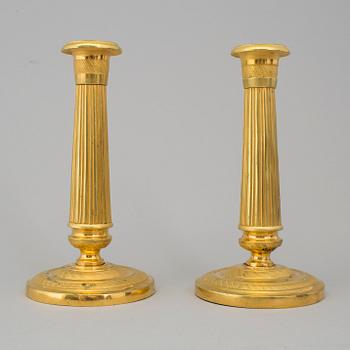 A PAIR OF EMPIRE CANDLESTICKS, first half of the 19th century.