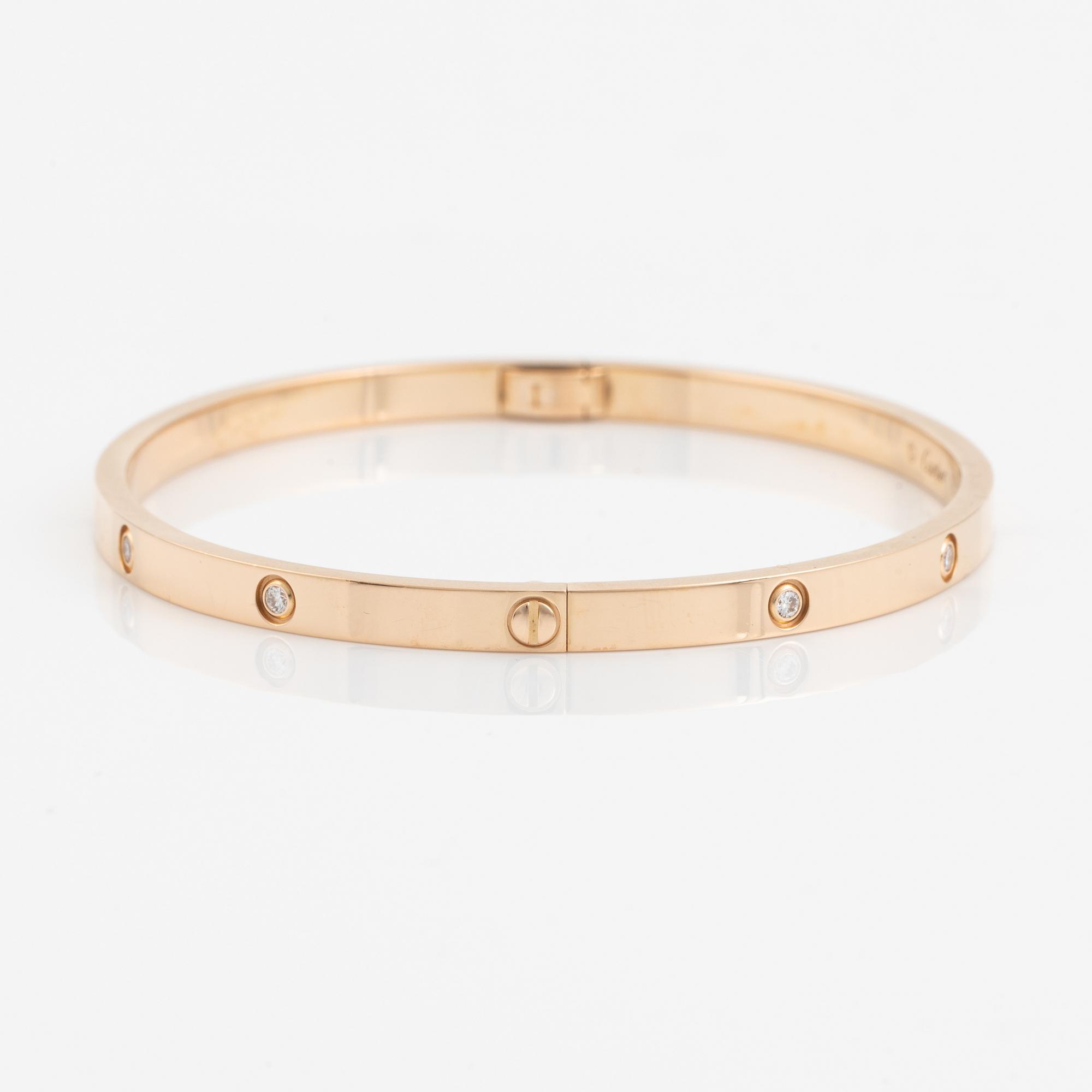 A Cartier "Love" bracelet small model in 18K rose gold with ten round brilliant-cut diamonds.