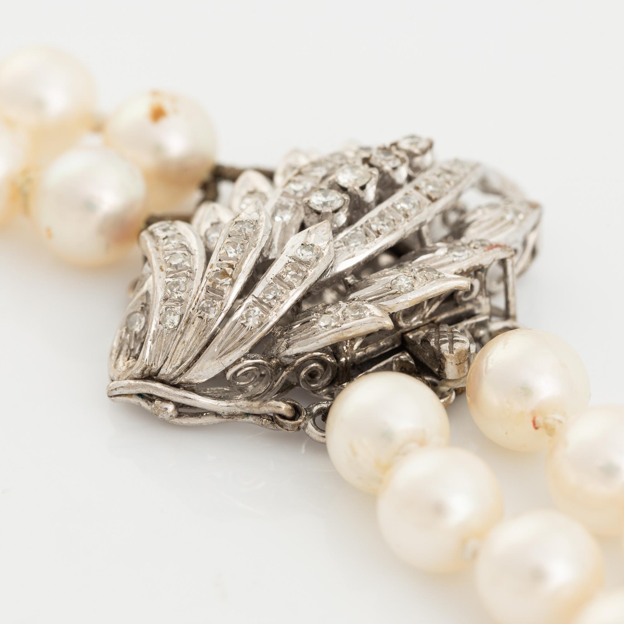 Two strand cultured pearl necklace, clasp with diamonds.
