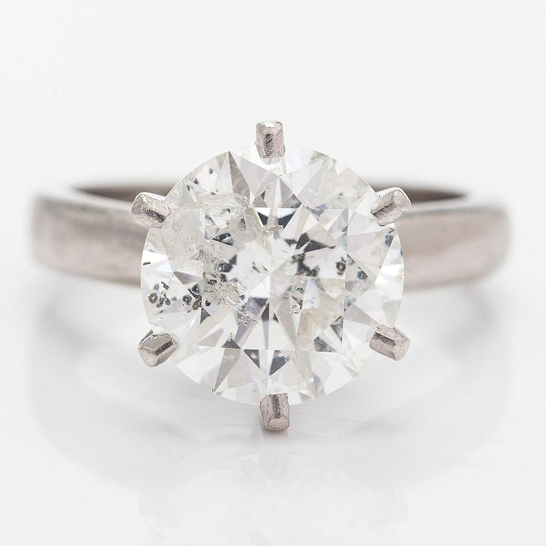 A platinum ring, with a brilliant-cut diamond approximately 3.10 ct. Domino Jewellery, Birmingham, England.