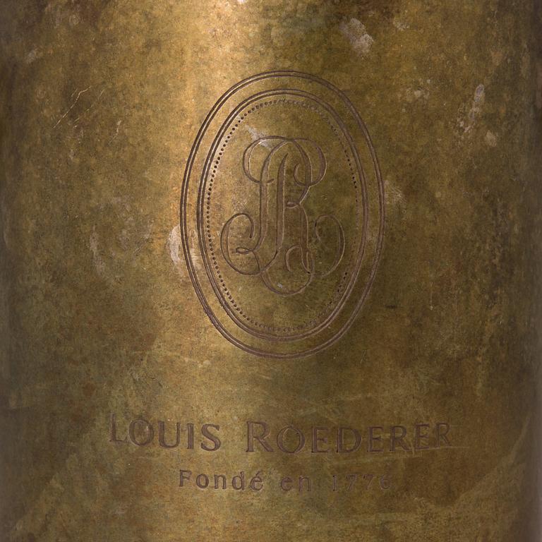 A Louis Roederer champagne cooler of silver plated brass.
