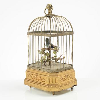 A music box in the shape of a bird's cage, France, late 19th century.