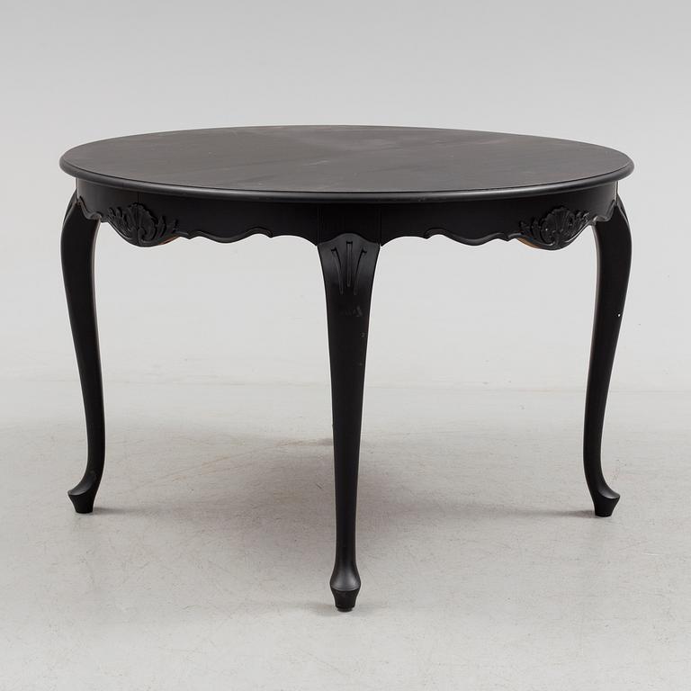A mid 20th century rococo style dining table.