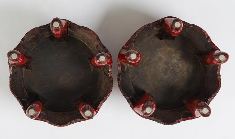 A pair of Chinese red lacquered stools/stands, early 20th century.