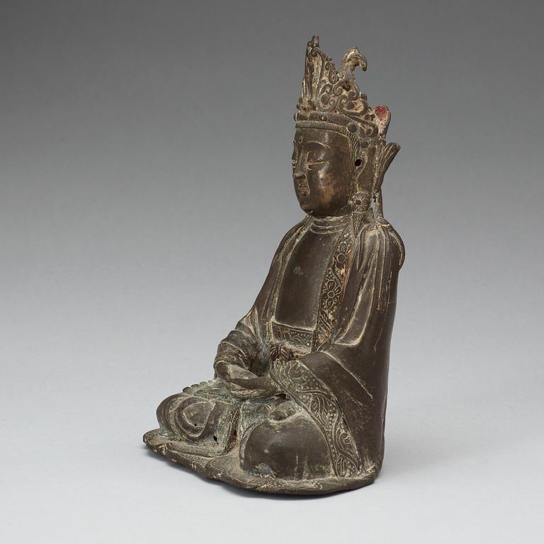 A bronze figure of a seated Guanyin, Ming dynasty.