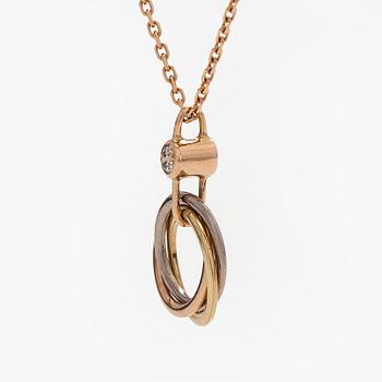 Cartier, an 18K gold 'Trinity Pendant' necklace with a brilliant-cut diamond.