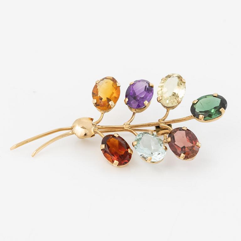 Brooch, 18K gold with citrine, amethyst, and tourmaline among others.