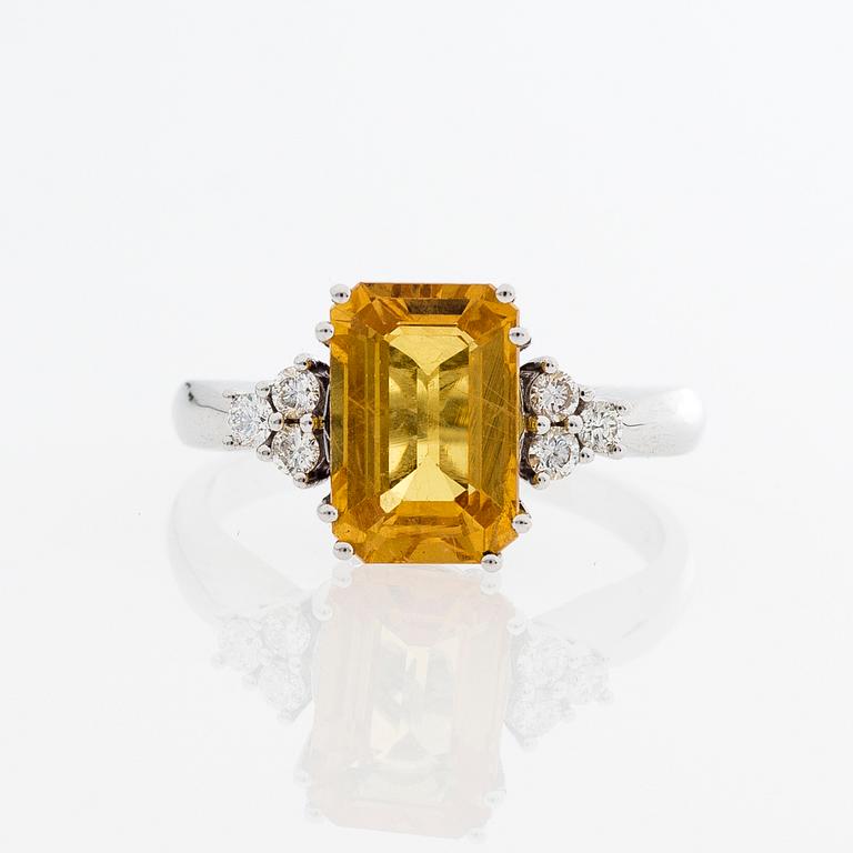 A RING, emerald cut yellow sapphire, brilliant cut diamonds, 18K white gold.