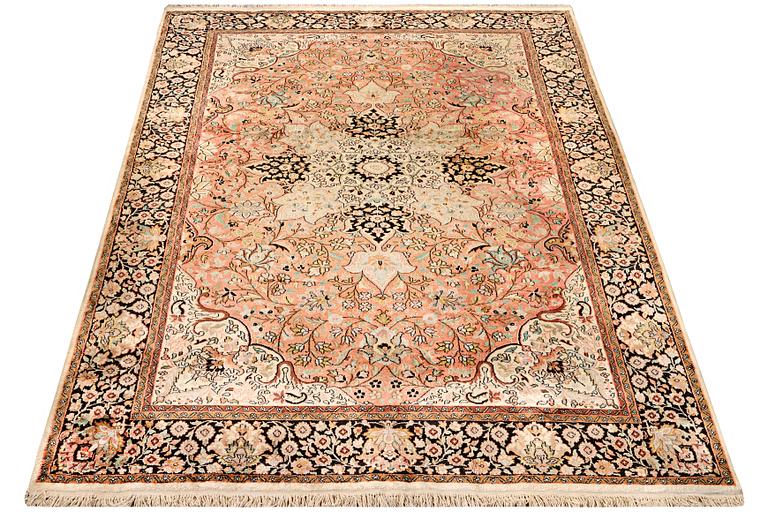 A silk Kashmar carpet, c. 280 x 177 cm.