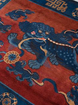 A CARPET, an old Baotou figural, China, ca 162,5 x 233,5 cm.