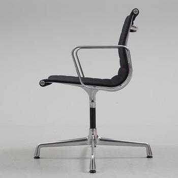 A 'EA 104 Swivel' armchair by Charles & Ray Eames, Vitra, 2016.