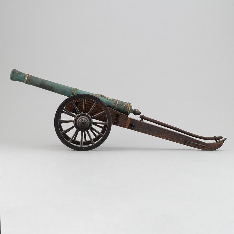 A copy of a field canon with monogram of king  Karl XII produced by Svensk Metallkonst, Carlscrona in late 20th century.