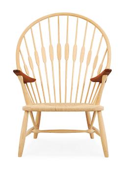 61. A Hans J Wegner ash and teak 'Peacock chair', by PP Møbler, Denmark.