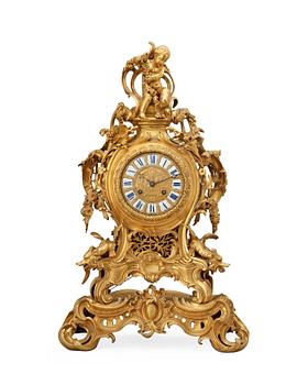 802. A neo Rococo 19th century gilt bronze mantel clock.
