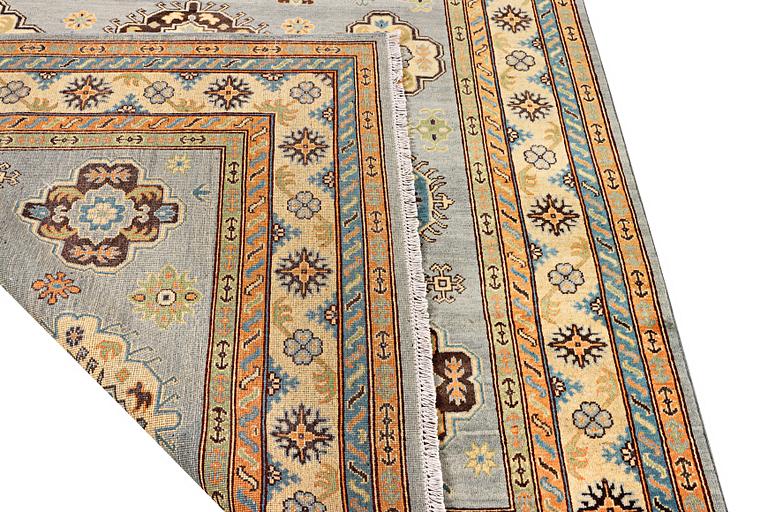 A Kazak carpet, c. 295 x 206 cm.