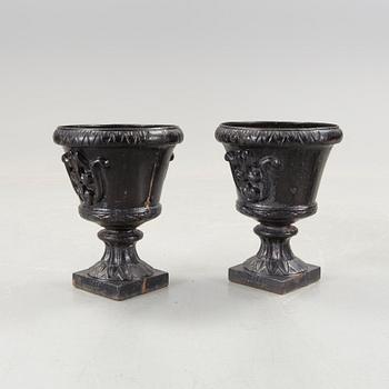 A pair of cast iron garden urns, Norrtälje.