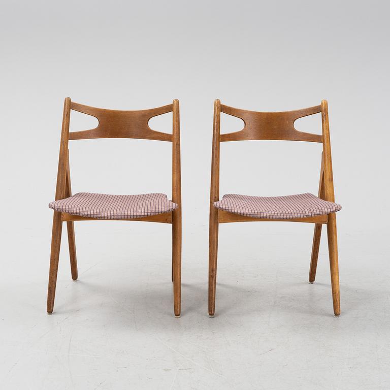 A set of six model CH 29 'Savbukstolen' by Hans J Wegner, designed 1952.