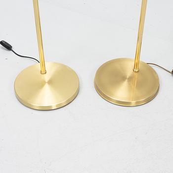 A pair of brass floor lamps, EWÅ, Sweden, second half of the 20th century.