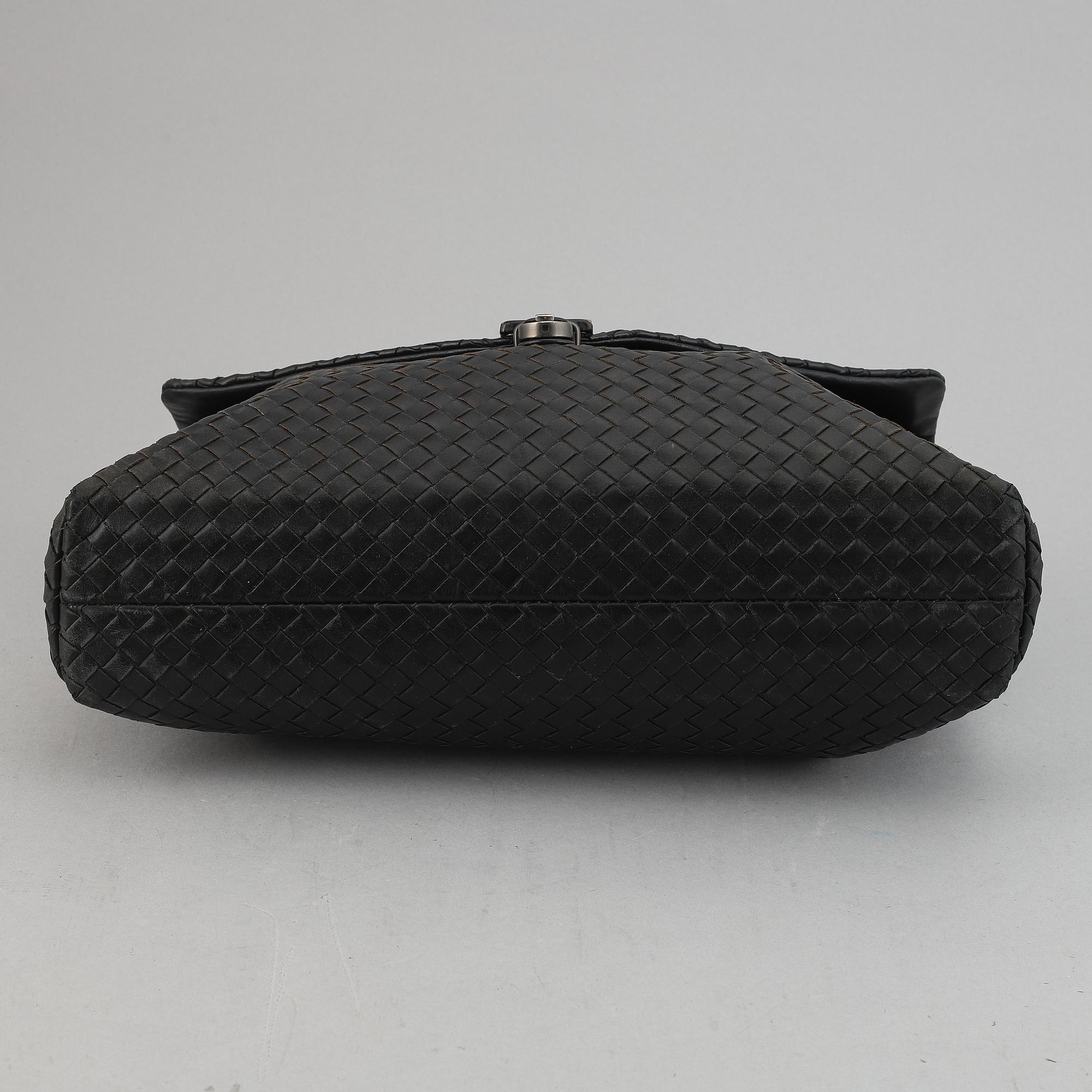 Bottega Veneta, a black intrecciato leather briefcase.
