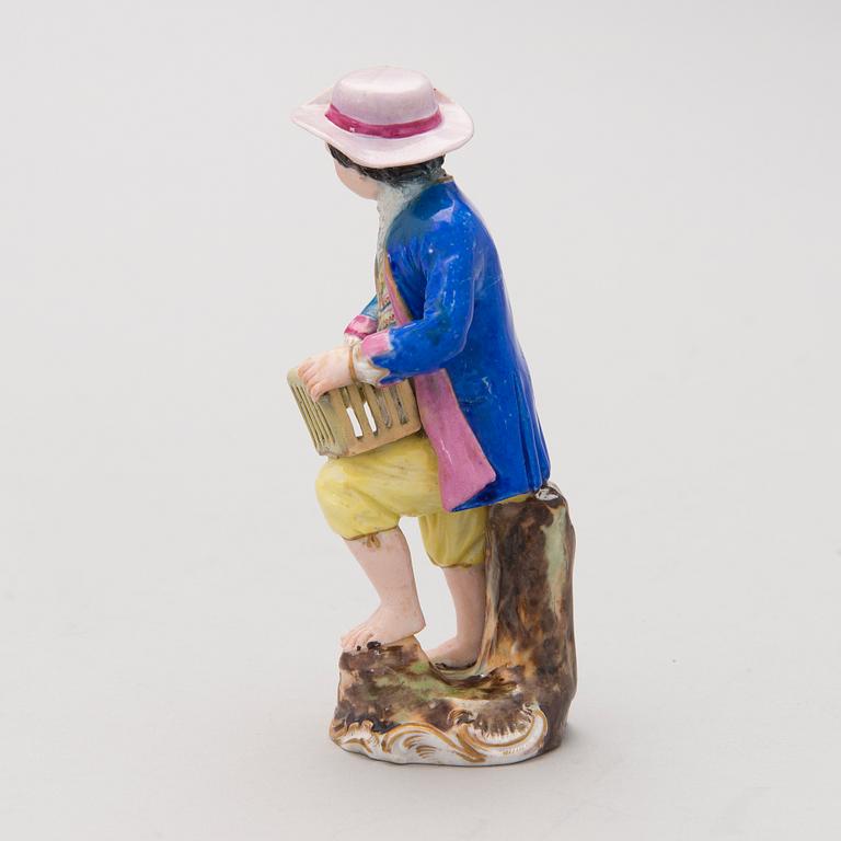 A MID 19TH CENTURY RUSSIAN POPOV FACTORY PORCELAIN FIGURINE.