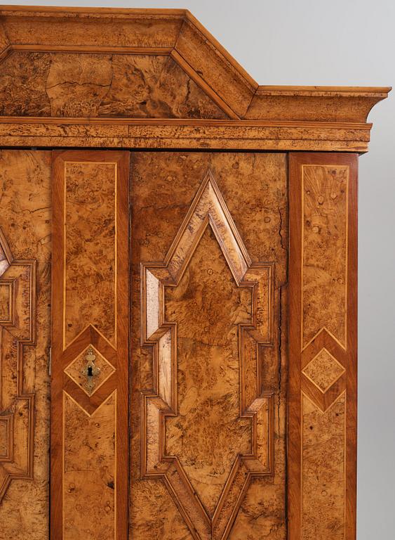 A Swedish Fredrik I burr-alder cabinet, first part of the 18th century.