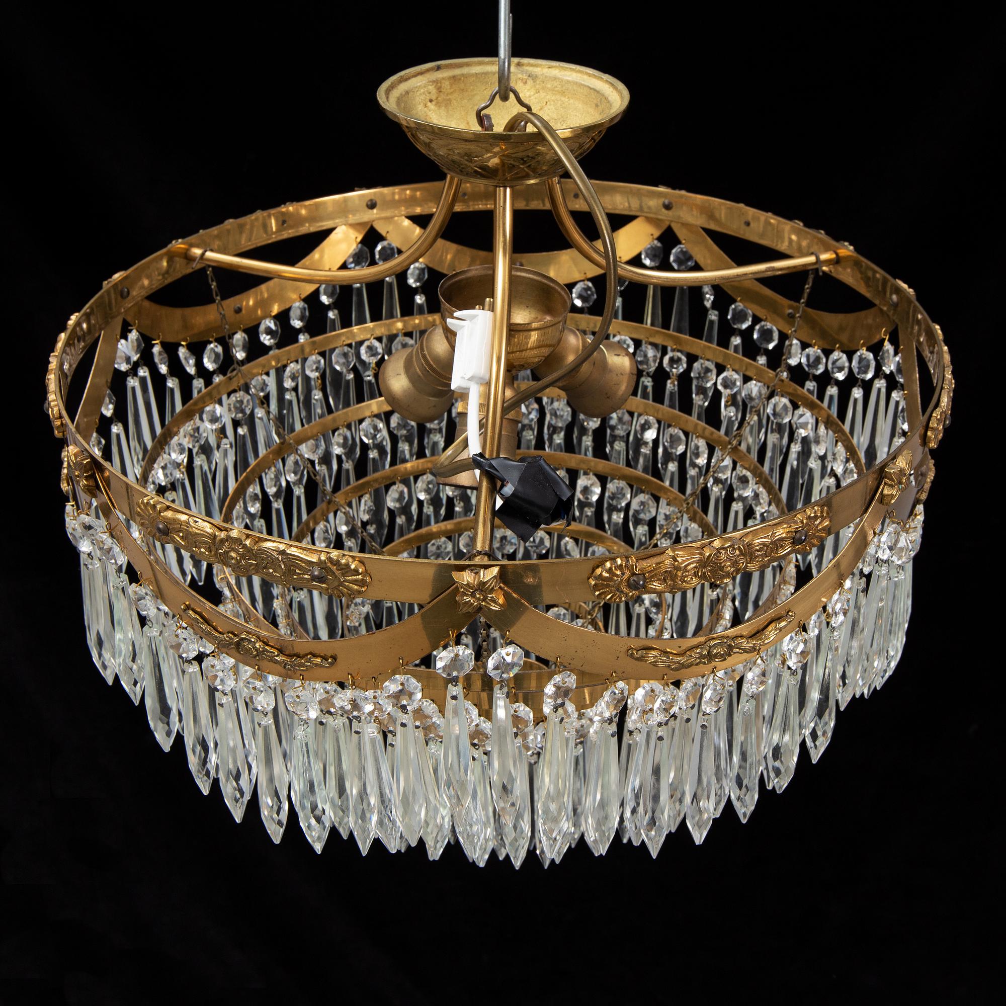 An end of the 20th Century ceiling light with prisms.