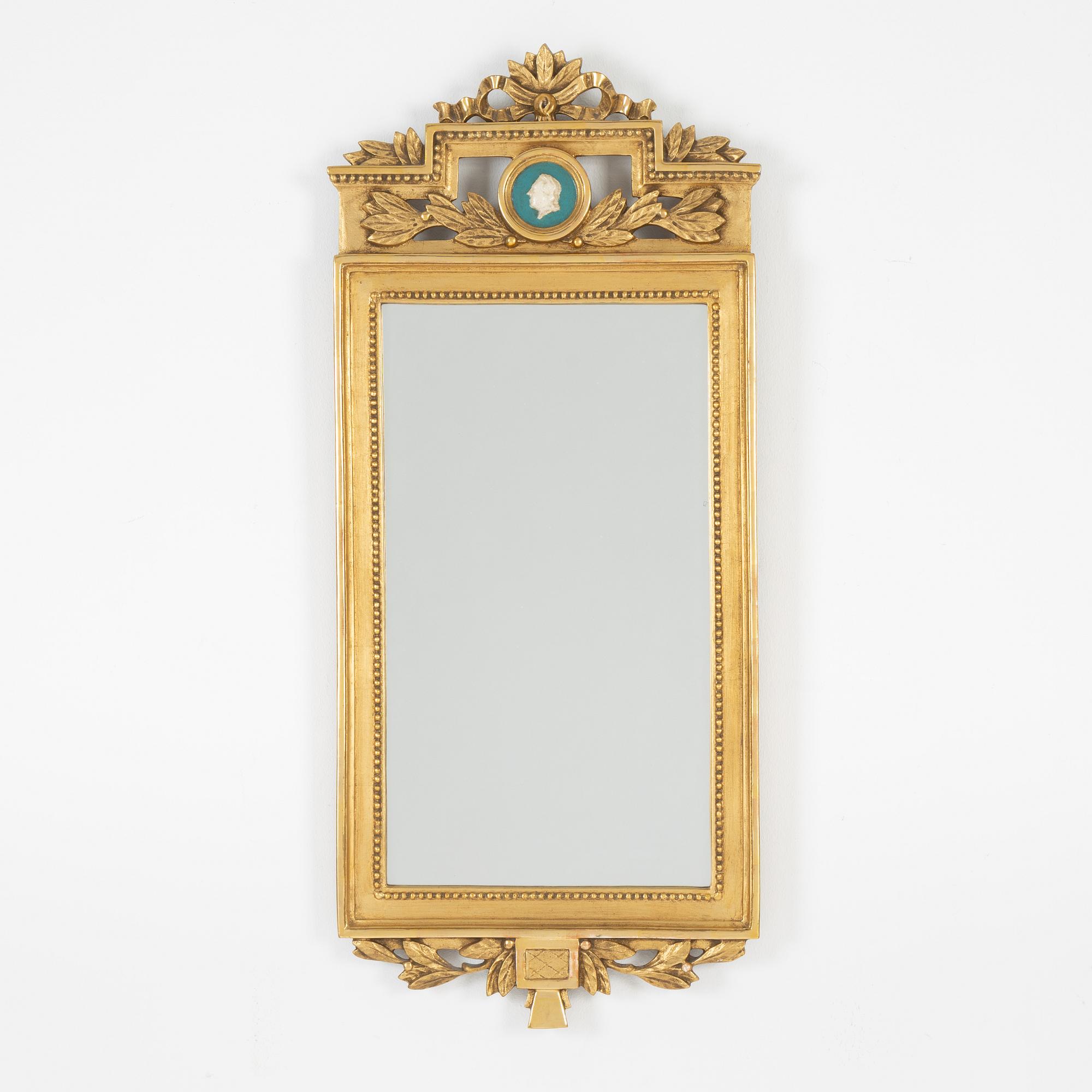 A Gustavian style mirror, mid 20th Century.