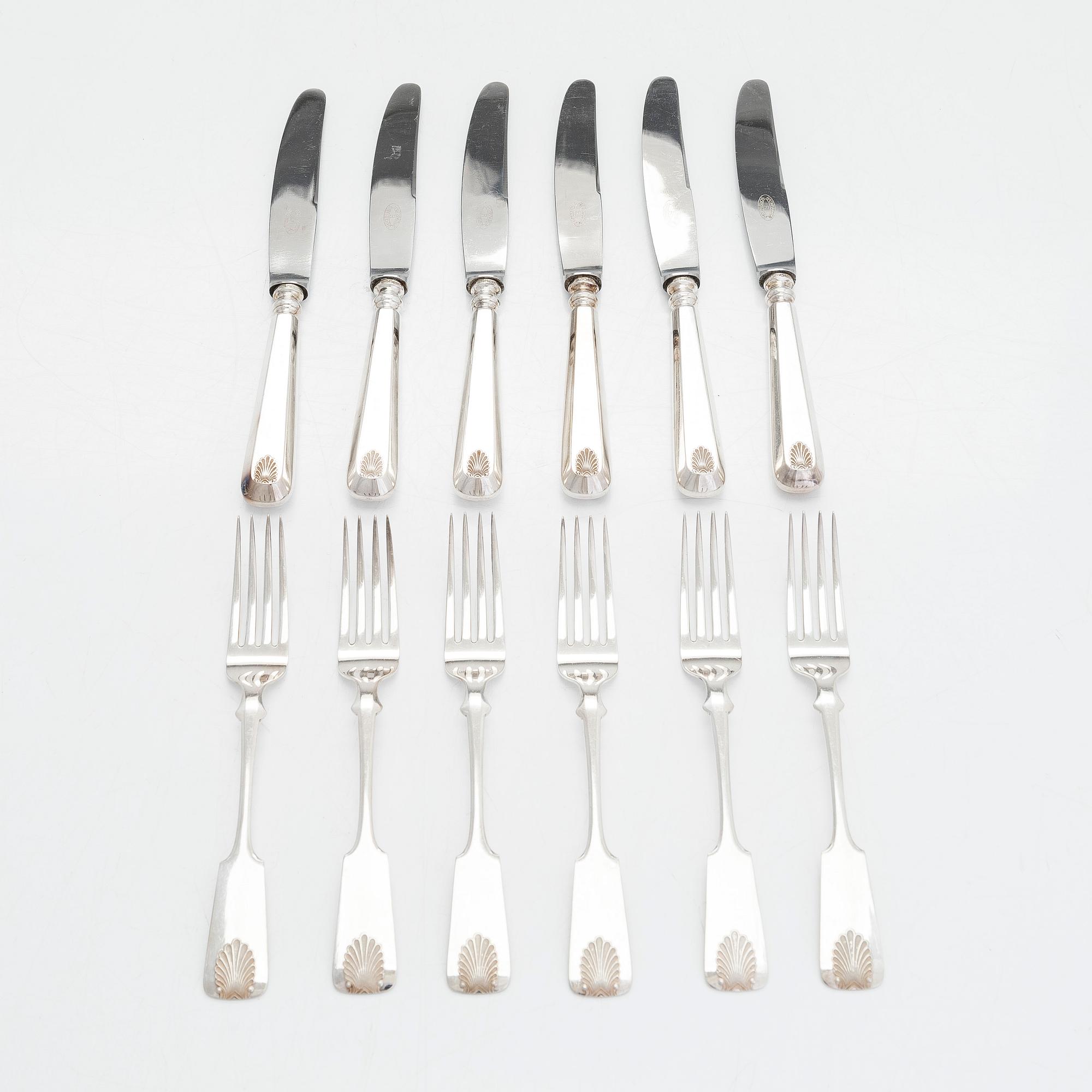 Bestickuppsättning, 24 delar, silver, "Musslan", finska stämplar, Åbo, Tavastehus, Helsingfors 1925-1953.