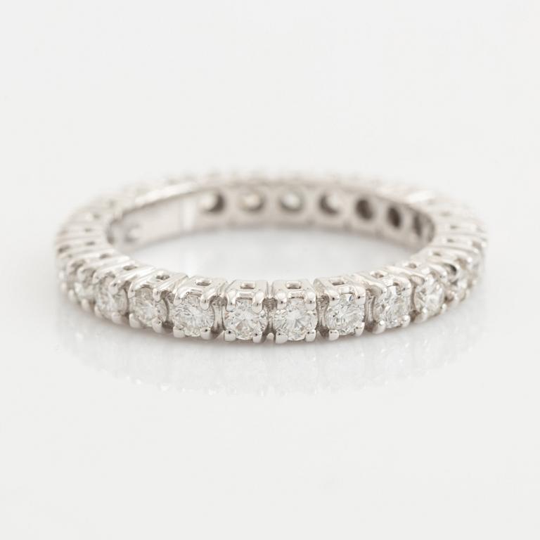 Brilliant cut diamond eternity ring.
